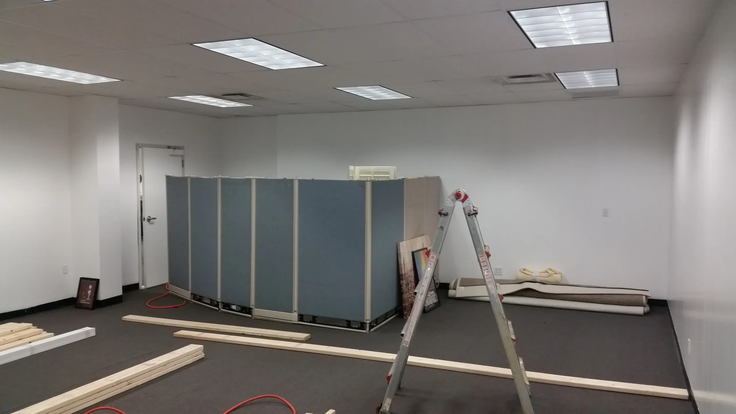 Commercial renovation in progress with partitions and ladder